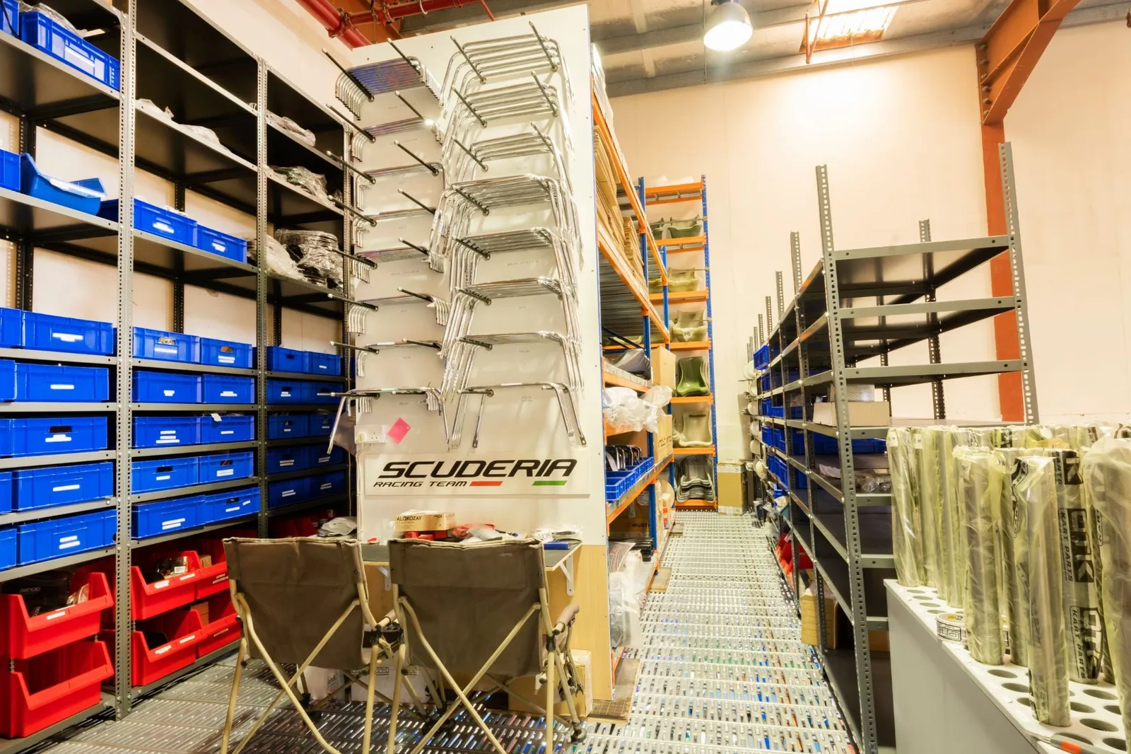 Kart bumper display under the Scuderia Racing Team sign