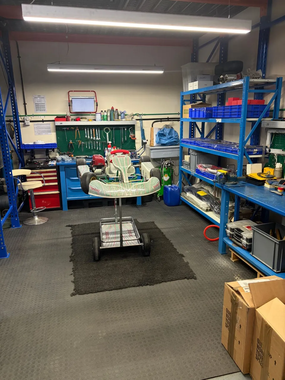 Kart workshop with a Tony Kart on its stand